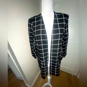 Women’s lightweight black and white open blazer.
